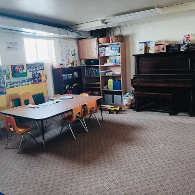 Children's Sunday School room with table and piano