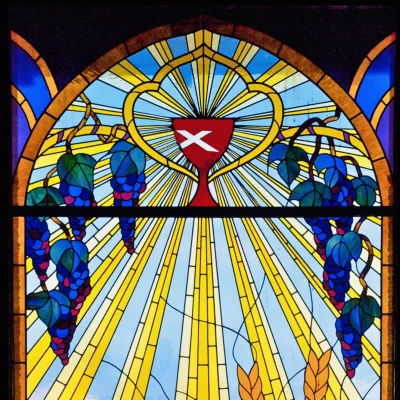 Stained glass Disciples of Christ chalice with grapes
