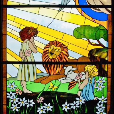 Stained glass children with lion and flowers